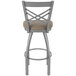 A Holland Bar Stool stainless steel outdoor counter stool with a tan cushion.