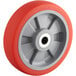 A Wesco Industrial Products wheel with a red and grey rubber rim.