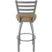 A Holland Bar Stool outdoor extra tall bar stool with a beige cushion and backrest.