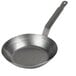 A close-up of a Vollrath carbon steel frying pan.