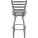 A Holland Bar Stool stainless steel outdoor restaurant bar stool with a ladderback and Breeze sidewalk seat.