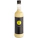 A close up of a bottle of Twisted Alchemy Cold-Pressed Eureka Lemon Juice with a yellow and black label.