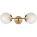 A Globe Modern Brass Wall Sconce with two frosted glass globes.