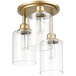 A Globe matte gold ceiling light with clear glass shades.