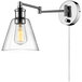 A Globe wall sconce with clear glass shade.