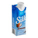 A blue carton of Silk Vanilla Almond Milk on a white background.