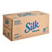 A case of 18 Silk Vanilla Almond Milk cartons.