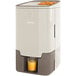 A Zummo Viva Z25-BR brown commercial juicer with orange juice in it.