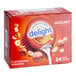 A box of International Delight Hazelnut coffee creamer single serves.