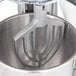 A Hobart mixer with a Hobart aluminum flat beater attachment.