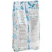 A white bag of Valrhona Caraibe 66% Dark Chocolate Feves with blue and black text.