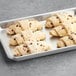 A gray tray of Gourmand chocolate hazelnut croissants.