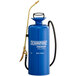 A blue metal Chapin sprayer with gold accents and a hose.