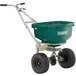 A green Chapin landscape spreader with wheels.