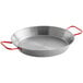 A close-up of a Vigor 11" polished carbon steel paella pan with red handles.