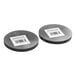 A pair of round metal honeycomb waffle plates with barcodes.