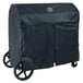 A black Crown Verity BBQ cover on a cart with wheels.