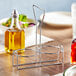 A metal Choice 2-compartment condiment holder on a table.