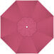 A hot pink sunbrella replacement canopy with a white circle in the center.