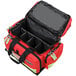 A red Kemp USA professional trauma bag with black straps and two compartments.