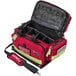 A red and black Kemp USA Professional Trauma Bag with a strap.