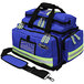 A royal blue Kemp USA professional trauma bag with reflective tape.