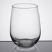 A Libbey customizable stemless white wine glass on a table.