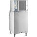 A large white Scotsman air cooled ice machine with a metal panel.