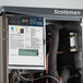 A Scotsman Prodigy Elite medium cube ice machine with a dispenser.