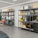 An AR Shelving boltless shelving unit in a garage with tools on the shelves.