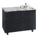 An Ozark River Manufacturing black metal portable sink with two deep basins and a faucet on a counter.