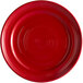 A red plate with a circular pattern on it.