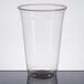 A clear plastic Dart Conex cold cup.