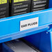 A blue shelf with Regency black and white labels in black and white label holders.