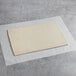 A rectangular piece of LeCoq Cuisine croissant dough sheet on a table.