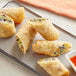 A plate of fried Franklin Farms vegan egg rolls with dipping sauce.