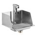 A stainless steel Regency glass filler station with a silver faucet above a metal sink.