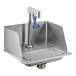 A stainless steel sink with a Waterloo glass filler station and blue glass filler handle.