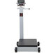 A Cardinal Detecto portable digital floor scale with wheels.