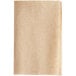 A beige Tork dispenser napkin with a brown paper background.