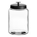 An Acopa clear glass jar with a black metal lid.