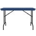 A blue rectangular Correll plastic folding table with black legs.