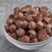 A bowl of Gertrude Hawk Mini Milk Chocolate Caramel Cups.