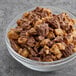 A bowl of REESE'S Peanut Butter Cup topping on a table.