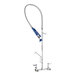 A blue and silver metal Waterloo pre-rinse faucet with a hose.