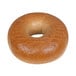 An Original Bagel whole wheat bagel with a hole in the middle.