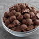 A bowl of Gertrude Hawk milk chocolate caramel turtles.