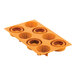 A Silikomart orange silicone baking mold with 8 Michetta-shaped compartments.