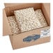 A cardboard box full of Dried Large Lima Beans.