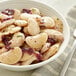 A bowl of Dried Large Lima Beans with red onions and parsley.